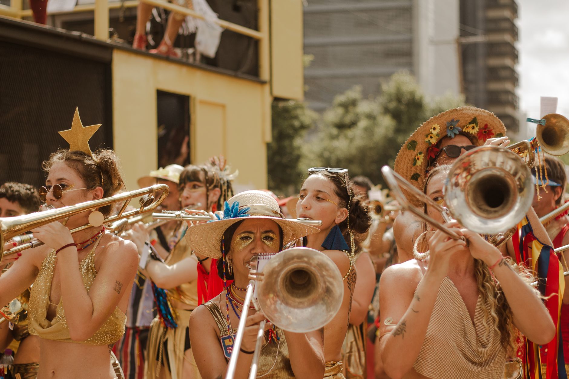 Colorful street parade featuring musicians and festive costumes, embracing celebration and joy.