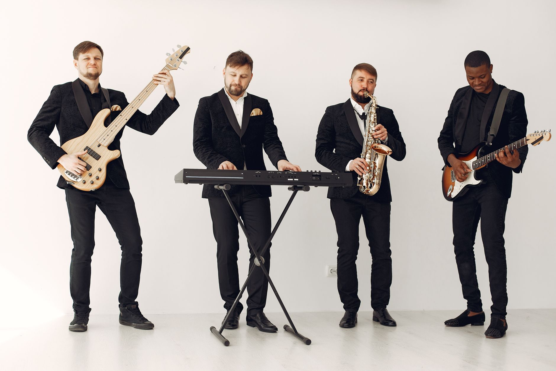 A modern jazz band with diverse musicians performing indoors with various instruments.