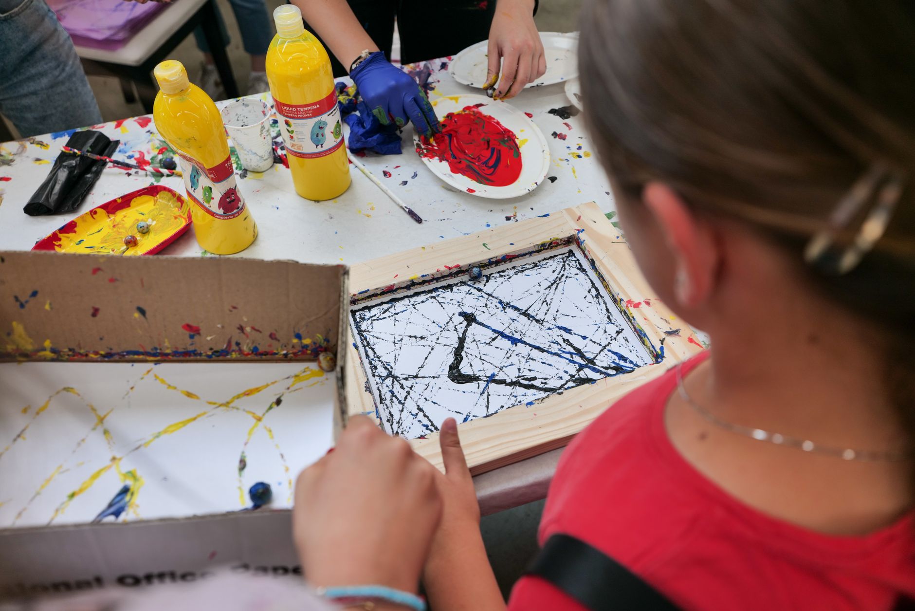 Children engaging in a fun painting activity during an art class in Garešnica.